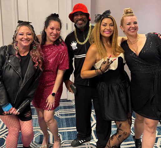 Employess dressed up for a themed holiday party.