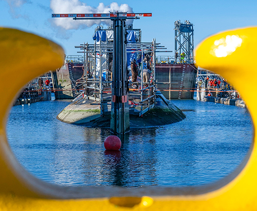 A submarine under repair in a dry dock.