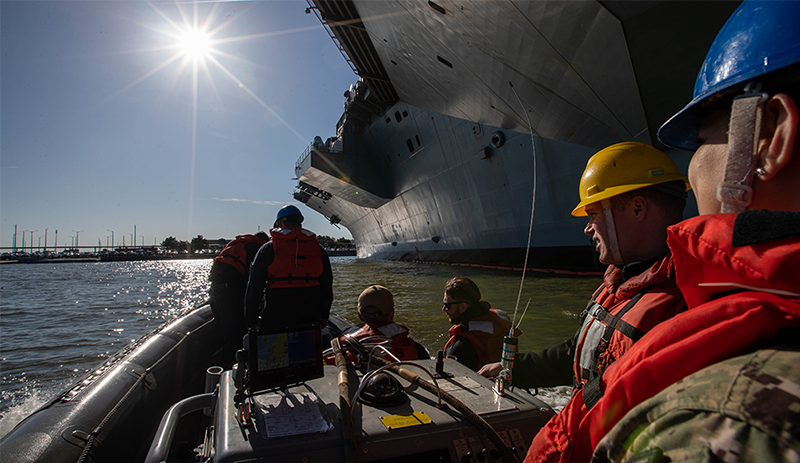 Ship repair workers in a RHIB.